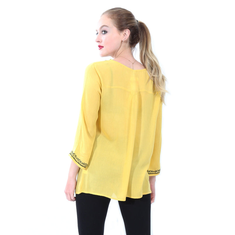 Blusa de manga larga con bordado asimetrico color amarillo - Dosmastres.com